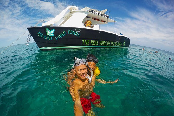 Full Day Beach BBQ Lunch & Snorkeling Excursion in Grace Bay - Onboard comfort: loungers, shade, and the fun factor