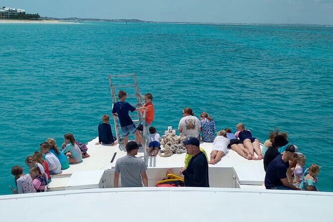 Group Reef, Beach and Sandbar Tour from Providenciales - Stop 1 at Grace Bay Beach: Reef Time and First-Thought Snorkeling